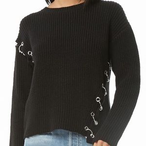 Pierced black sweater